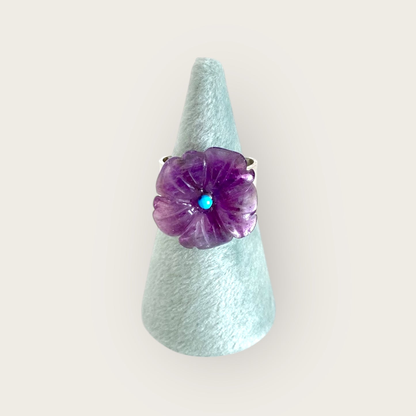 Silver pinky ring with carved amethyst flower