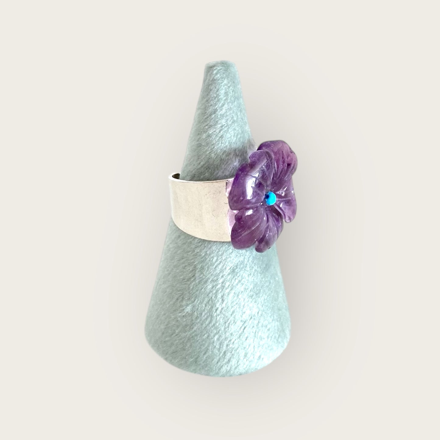 Silver pinky ring with carved amethyst flower