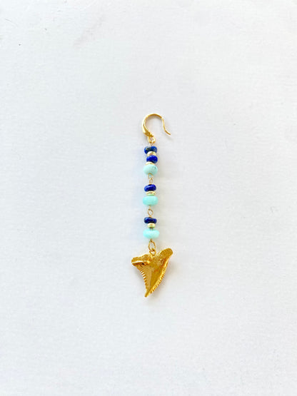 Single earring with tooth